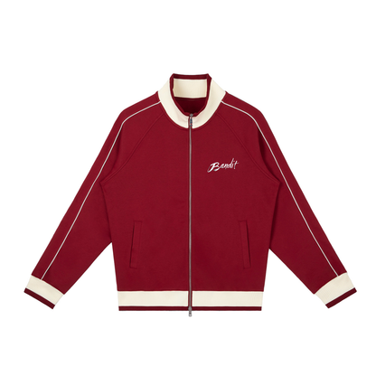 Veste de survêtement zippée raglan unisexe avec l’œuvre Peace in Ruins de Bandit représentant un aigle et une colombe autour d’un symbole de paix détruit. face rouge